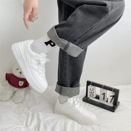 Classic all-white low-top sneakers