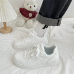 Classic all-white low-top sneakers