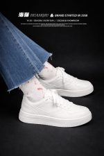 Classic all-white low-top sneakers