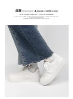 Classic all-white low-top sneakers