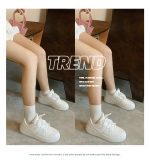 Classic all-white low-top sneakers